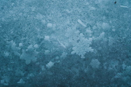 Natural snowdrift close up photo. Macro picture of snowflakes with crystals in good view. Snowflakes on snow. Winter background.の写真素材