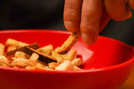 Unhealthy food. Croutons. Croutons in bowl. Unhealthy food for figure, heart, skin, teeth. Fast...