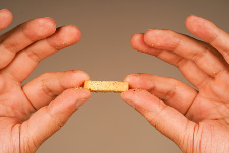 Croutons. Holding crouton in hands. Snack. Salty snack for beer.の写真素材