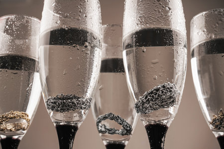 Viking Age Ring. Jewelry ring on the background of a glass. Four silver rings on a gray background.の写真素材