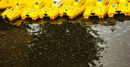 Prague, Czech Republic - May 11, 2019: Yellow kayaks on water. A river in Prague with water. River in city, entertainments for tourists in cities.の写真素材