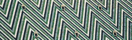 Vienna, Austria - May 12, 2019 Intricate zigzag pattern adorns sloped roof of historical building, featuring mix of green, white, blue, tiles. Small dormer windows peek out from patterned surface.の写真素材