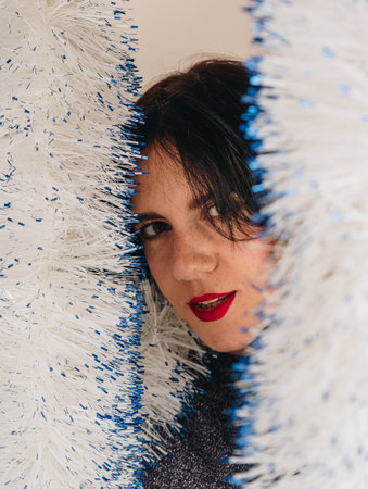 Peoples emotions, lifestyle, leisure and the concept of beauty. An optimistic happy and cheerful girl is dancing and having fun, moving to the rhythm of the music.の写真素材