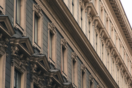 Vienna, Austria - May 12, 2019: Windows in a raw from left to right. Ancient architecture of residential buildings. Elite house, closeup photo of its windows. European architecture of apartments.の写真素材