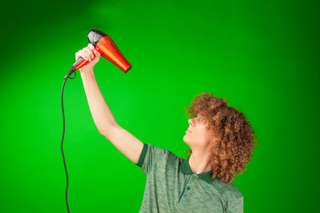 The glowing contrasts perfectly with the movement of the man s curls and shirt, animated by the...