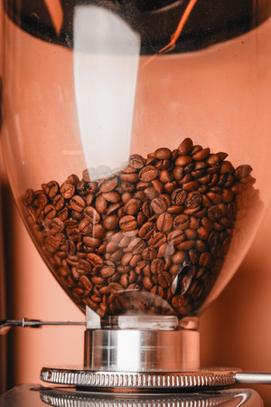 Close-up image of a coffee grinder in a coffee shop. Professional modern electric powder grinder. Cafe brewing service concept.の写真素材