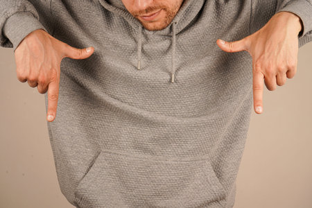 His precise gesture is engaging and intentional. The image conveys clarity and purpose. Pointing...