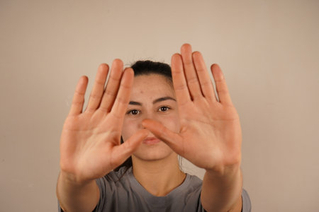 Both arms are raised high in a stretching gesture, symbolizing energy and renewal. The extended posture highlights relaxation and freedom. A moment of rejuvenation and release.の写真素材