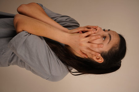 The interesting facial expression conveys a moment of surprise. The focus is on her emotions. A...