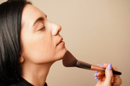 The warm lighting complements her natural skin tone. Her dark hair and serene expression create a...