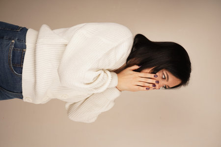 The interesting facial expression conveys a moment of surprise. The focus is on her emotions. A...