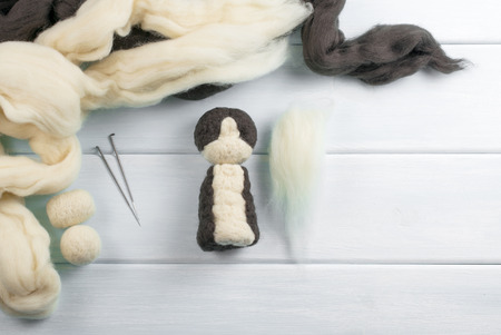Workspace with tools needle and skeins of wool for felting toys. Master class. Top view.の写真素材