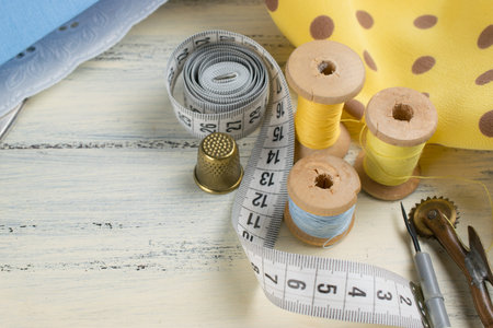 Set of reel of thread, centimeter, fabric, thimble, seam ripper and toothed wheel for sewing and...