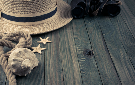 Travel set with tourist accessories on wooden background. Journey concept for holidays. Empty place for text.の写真素材