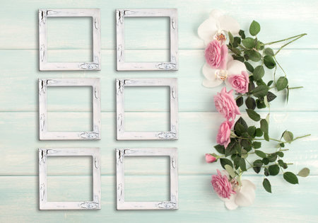 Wooden background with vintage craquelure frames, roses and orchid flowers and empty place for photo...