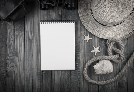 Travel set with tourist accessories on wooden background. Journey concept for holidays. Empty place for text.の写真素材