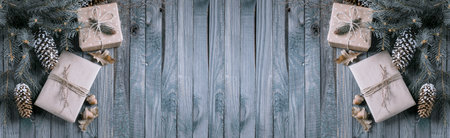 Christmas background with gift box in vintage style on wooden planks. New Year winter holidays...