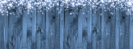 Christmas background in vintage style with snow and snowflakes on wooden planks. New Year winter holidays concept. Empty place for photo or text. Copy space.の写真素材