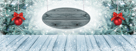 Christmas background with signboard, fir tree, two balls and snowfall. New Year winter holidays theme. Empty space for your decoration, text or advertising.の写真素材