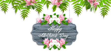 Floral garland with magnolia flowers and leaves isolated on white background and wooden signboard with greeting text for Mother's dayの写真素材