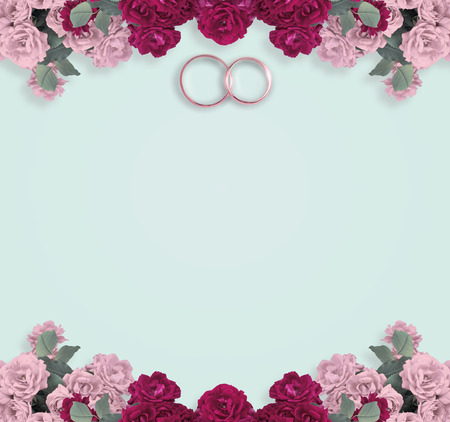 Top view of pink roses and bridal rings for wedding with place for your textの写真素材