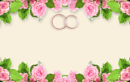 Top view of pink roses and bridal rings for wedding with place for your textの写真素材