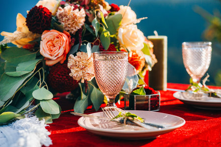 Vintage glass in boho style on the table of newlyweds