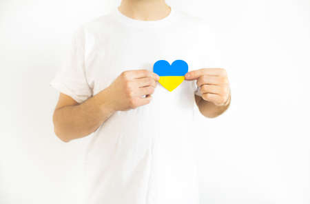 Love Ukraine concept. Hands in the shape of a heart are painted in the color of the flag of Ukraine - yellow and blue. selective focus. Independence Day of Ukraine, flagの写真素材