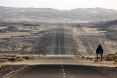 Tar road bends a cornerの写真素材