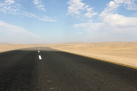 Tar road bends a cornerの写真素材
