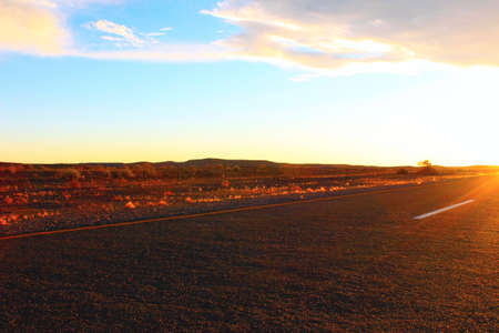 Sunset sky and road in the desertの写真素材