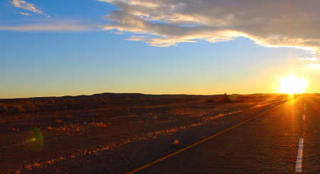 Sunset sky and road in the desertの写真素材