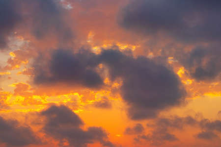 Beautiful vibrant sunset with dramatic cloudsの写真素材