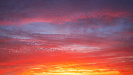 Beautiful bright sunset with multi-colored dramatic cloudsの写真素材