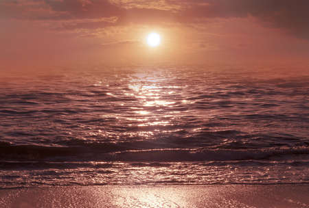 Sunrise over the sea and beautiful cloudscape. Meditation ocean and sky background.の写真素材