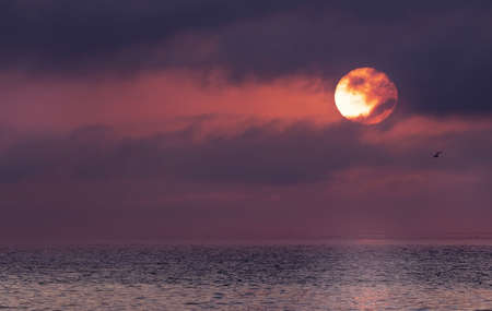 Sunrise over the sea and beautiful cloudscape. Meditation ocean and sky background.の写真素材