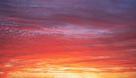 Beautiful bright sunset with multi-colored dramatic clouds