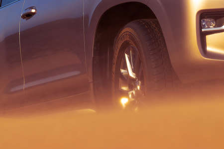 Close up of a golden car stuck in the sand in the Namib desert.のeditorial素材
