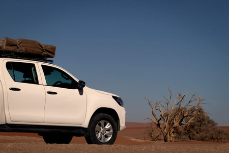 Toyota Hilux  standing in the middle of the desert 10.06.2021. Walvis Bay, Namibia. Africa