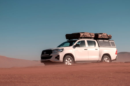 Toyota Hilux  standing in the middle of the desert 10.06.2021. Walvis Bay, Namibia. Africa