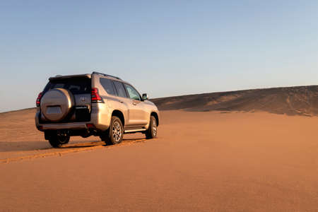 Toyota  Fortuner standing in the middle of the Namib desert on a sunny day. Namibia, Africaのeditorial素材