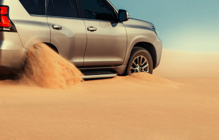 Stuck SUV in remote Namib Desert sand, editorial capture highlighting the reality of rugged driving conditions and desert exploration in Namibia.の写真素材