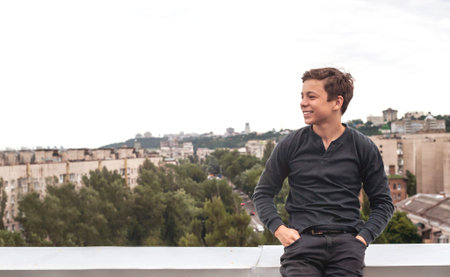 happy teenager on the roof of the of high house