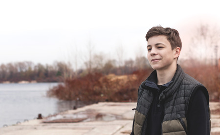 Stylish young man Standing near a Rivers on the waterfront の写真素材
