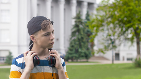 Stylish young man in headphones listening to musicの写真素材