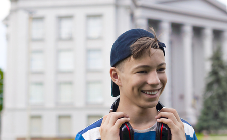 Young man with headphones listening to music in the parkの写真素材