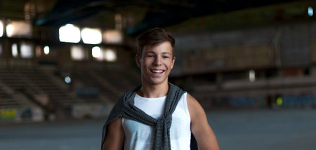 smiling young man in an old building, portrait