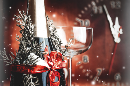 closed decorative champagne bottle with a red bowの写真素材