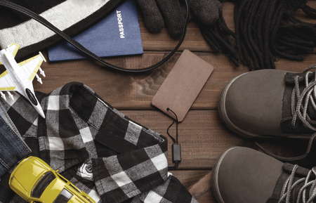 Clothing and stylish accessories for a boy on a brown backgroundの写真素材