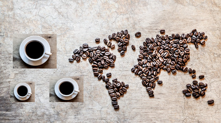 map of continents from coffee beans on an old wooden backgroundの写真素材